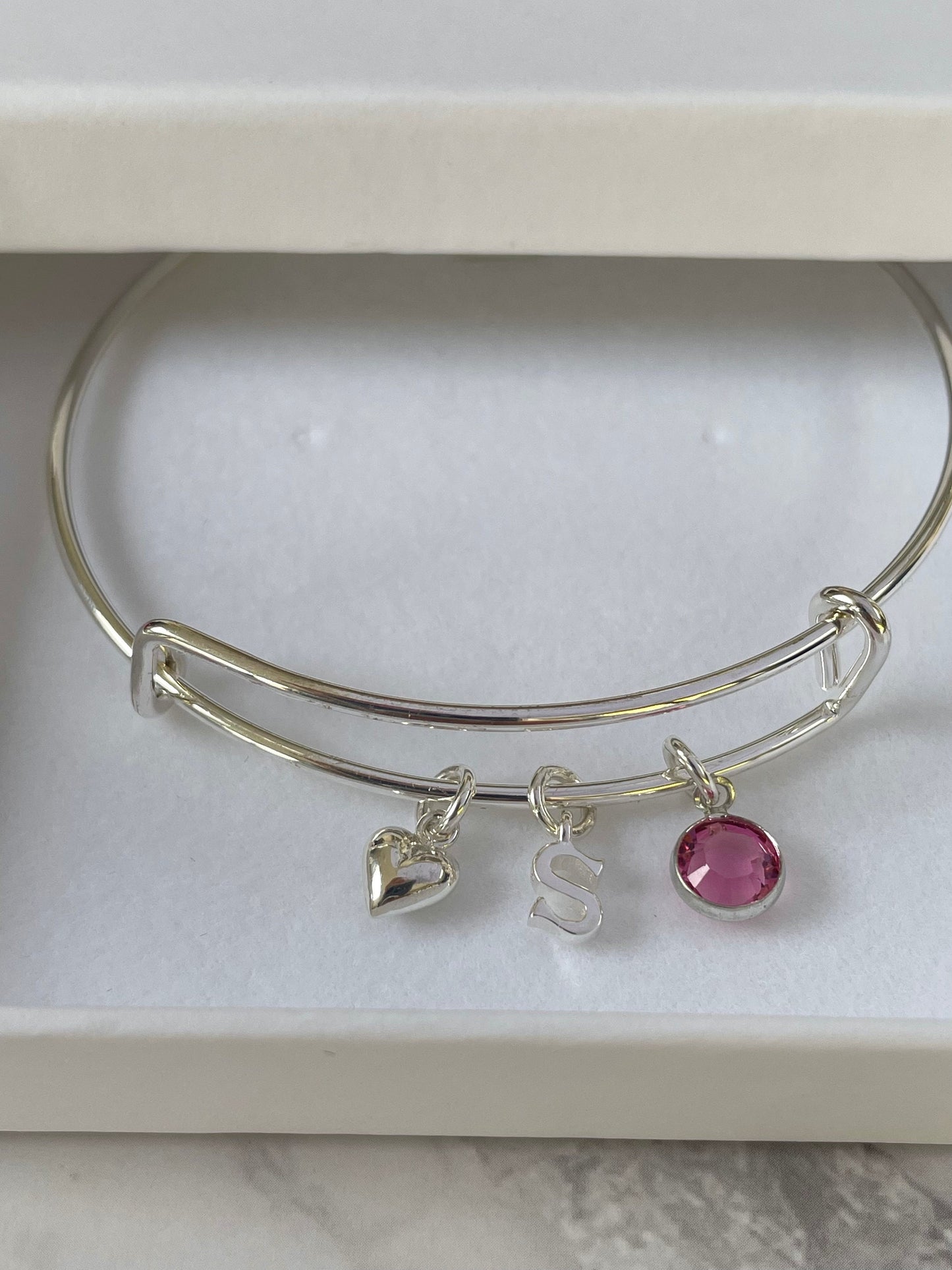 Silver-plated adjustable bangle with initial, birthstone and heart